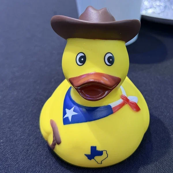 PyTexas 2026 swag: a yellow rubber duck with a cowboy hat and Texas-flag bandana